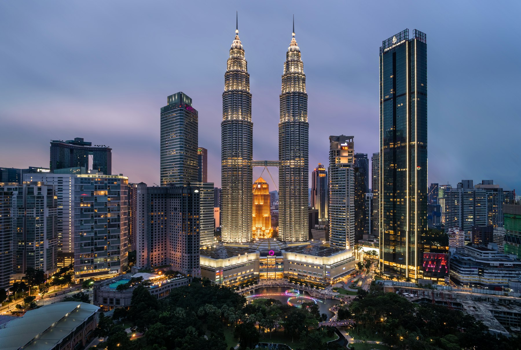 Petronas Towers and the Kuala Lumpur skyline at dusk