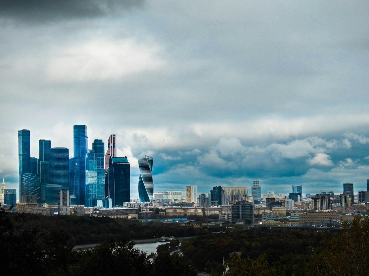 Moscow city skyline beneath a bright daytime sky